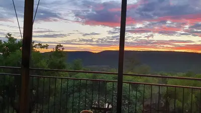a view of a sunset from a balcony at Zwartkloof View, Bela Bela in Bela-Bela