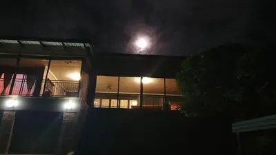 a house at night with a moon in the sky at Zwartkloof View, Bela Bela in Bela-Bela