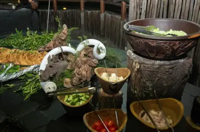 a table with a bunch of vegetables on it at Thornhill Safari Lodge in Hoedspruit