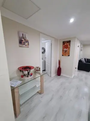 a living room with a glass table and a couch at Cozy Cabin in Midrand