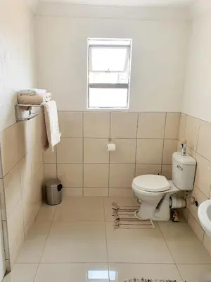 a bathroom with a toilet and a sink at Mminanoko Eco Guesthouse in Mamphokgo