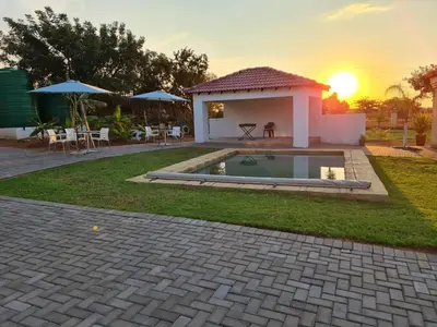 a house with a swimming pool in the yard at Mminanoko Eco Guesthouse in Mamphokgo