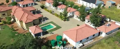 an aerial view of a house with a pool at Mminanoko Eco Guesthouse in Mamphokgo
