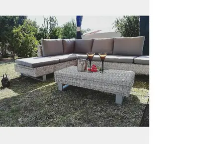 a couch and a table with two glasses on it at Mrhali Boutique Guest House in Kwamhlanga