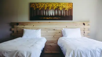 two beds sitting next to each other in a bedroom at Buffalo House @Bankenkloof Private Game Reserve in Tierpoort