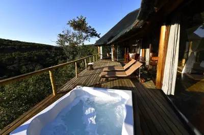 a tub on the deck of a house at Sediba Luxury Safari Lodge in Welgevonden Game Reserve
