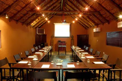 a large dining room with long tables and chairs at Sediba Luxury Safari Lodge in Welgevonden Game Reserve