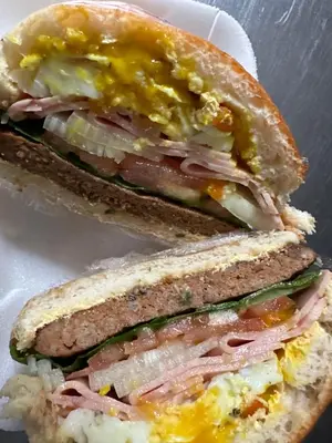 two halves of a sandwich with ham and cheese at Dara on Schabort street in Trichardt
