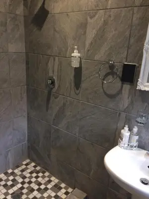 a bathroom with a shower and a sink at B&B 464 on 22nd Ave in Pretoria