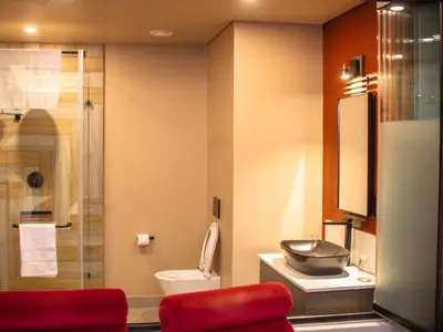 a bathroom with a toilet and a sink and a shower at MGB Hotel at 2ten in Thohoyandou