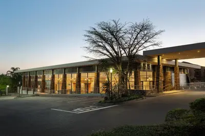 an empty parking lot in front of a building at Premier Hotel Midrand in Midrand
