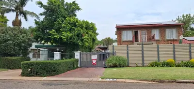 a house with a gate and a fence at Christa's Place 897 in Pretoria