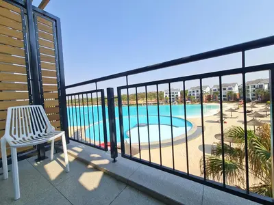 a balcony with a view of a swimming pool at MINT Resorts The Blyde in Pretoria