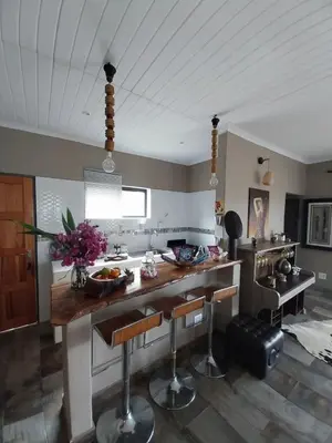 a kitchen with a large island in a room at hippomoon lodge game reserve in Hoedspruit