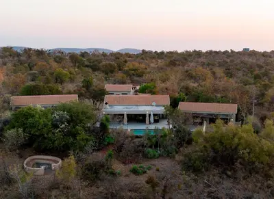 an aerial view of a house in the woods at Elements Private Golf Villa 295 in Mabula