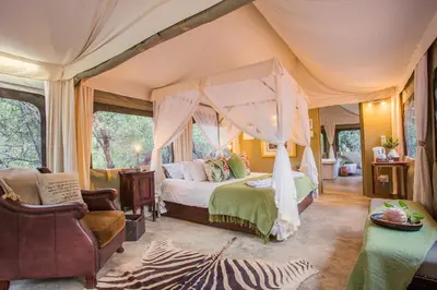 a bedroom with a canopy bed in a tent at Zwartkloof Adventures Tented Camp in Bela-Bela