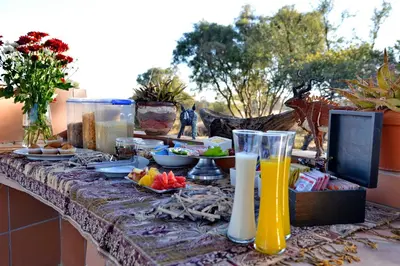 a table with food and drinks on top of it at Kameeldrift Waterfront Estate & Resort in Brits
