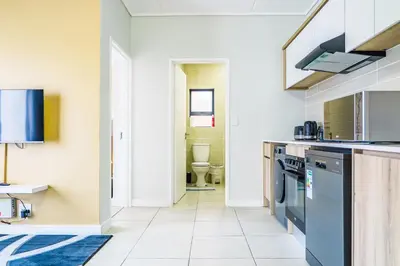 a kitchen with a stove and a sink at Insaka 1 The Blyde Crystal Lagoon Experience in Pretoria