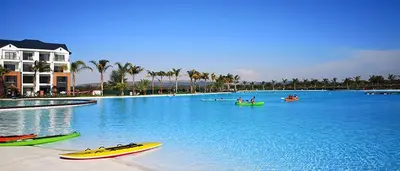 a large swimming pool with kayaks in the water at Insaka 1 The Blyde Crystal Lagoon Experience in Pretoria