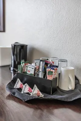 a tray filled with cards and a coffee mug at Hotel 247 @ White River in White River