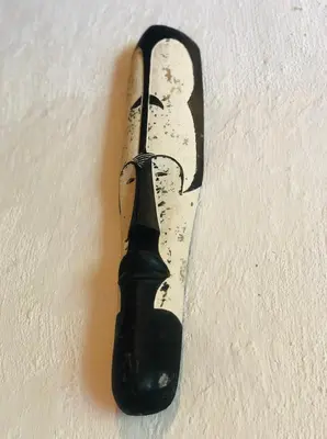 a black bottle sitting on top of a wall at Ndoto Cottage in Hoedspruit