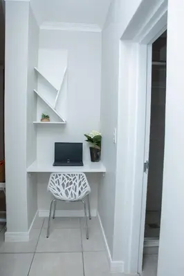 a white desk with a laptop on a chair at The Blyde Riverwalk Estate, Crystal Lagoon, Pretoria east in Pretoria
