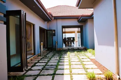 a hallway of a house with a walkway at Dam View HOUSE in Hartbeespoort