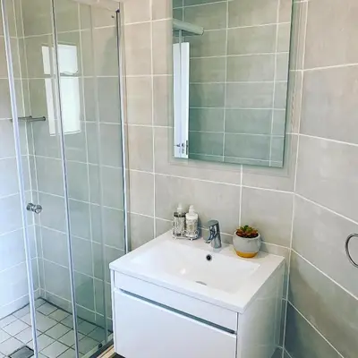 a bathroom with a sink and a shower at The Blyde Magna Host Luxury Apartments in Pretoria