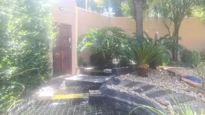 a house with a garden with plants and a door at Halfway Gardens Home in Midrand