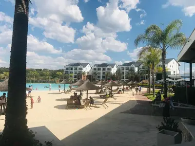 a group of people on the beach at a resort at The blyde Pretoria unit 1244 in Pretoria