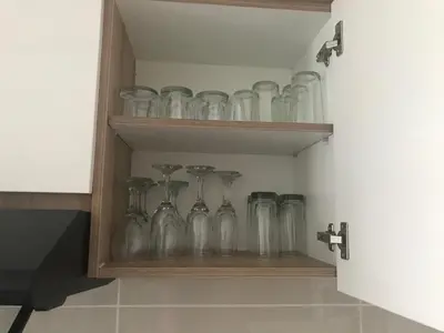 a bunch of glassases are sitting on a shelf at The blyde Pretoria unit 1244 in Pretoria