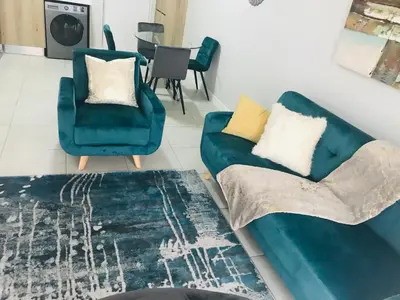 a living room with a couch and two chairs at The blyde Pretoria unit 1244 in Pretoria