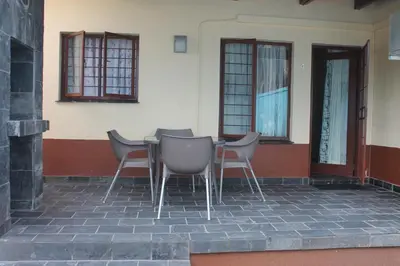a table and chairs sitting outside of a building at Lalamnandzi3 in Nelspruit
