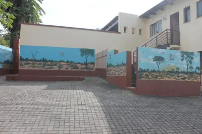 a building with paintings on the side of it at Lalamnandzi3 in Nelspruit