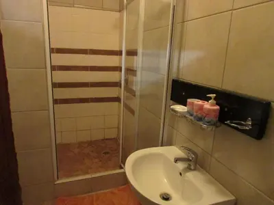 a bathroom with a shower and a sink at Lalamnandzi1 in White River