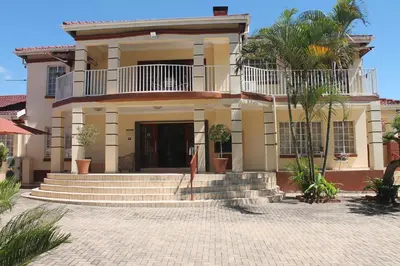 a large house with stairs in front of it at Lalamnandzi2 in White River