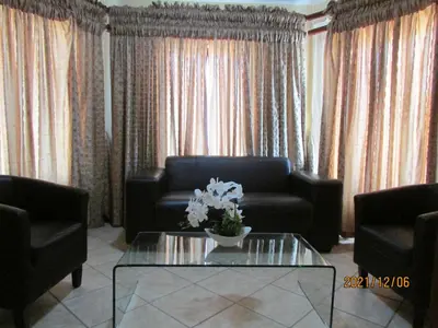 a living room with a couch and a coffee table at Lalamnandzi2 in White River