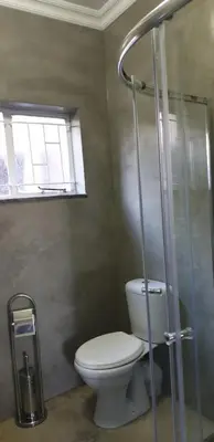 a bathroom with a toilet and a shower at Rand Self-catering Accommodation in Carolina