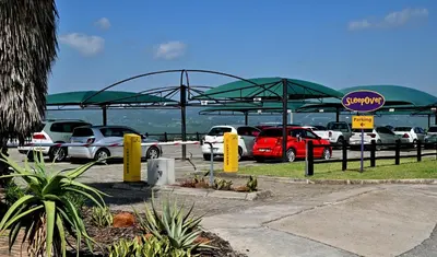 a parking lot with cars parked in a parking lot at SleepOver KMIA in White River