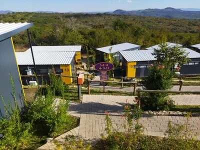 a small village with yellow buildings and a clock at SleepOver KMIA in White River