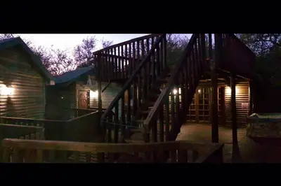 a set of stairs leading to a wooden house at Tranquillity Holiday Home in Marloth Park