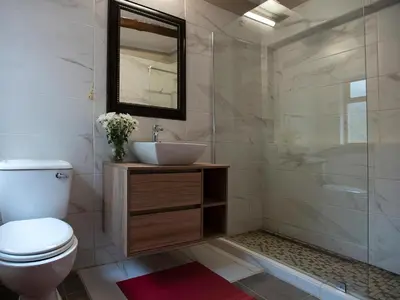 a bathroom with a toilet and a sink and a mirror at Mabalingwe Elephant Lodge 267-7 & 267-8 in Mabula