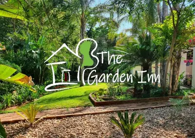 a sign for a garden in a yard at The Garden Inn Guesthouse in Modimolle