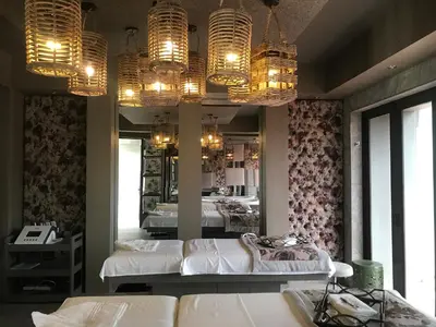 a bedroom with two beds and chandeliers and a mirror at Palala Boutique Game Lodge and Spa in Tom Burke