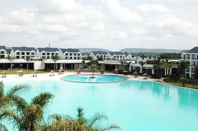 a large swimming pool in front of a resort at Insaka 3 The Blyde Lagoon Experience in Pretoria