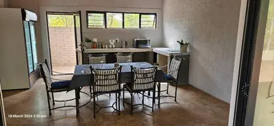 a dining room with a table and chairs at Kolope Lodge in Alldays
