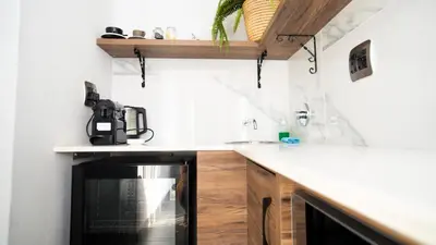 a kitchen with a counter and a stove top oven at Alveston Manor Boutique Hotel & Spa in Middelburg