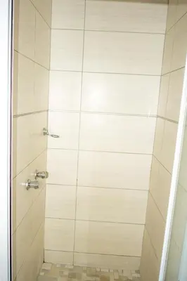 a shower stall with a glass door at Sunninghill Luxury Spacious Executive Penthouse in Sandton