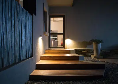 a set of stairs with lights on the side of a building at Fairfarren in Hoedspruit