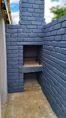 a brick wall with a bench inside of it at Sheilas Self-Catering Overnight Accommodation in Polokwane